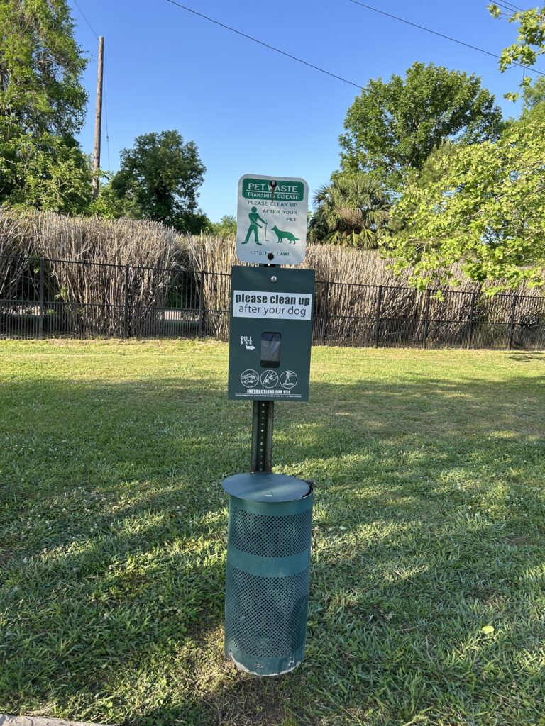 Dog waste bag dispenser at Nola City Bark on walking path Dog waste bag dispenser at Nola City Bark on walking path