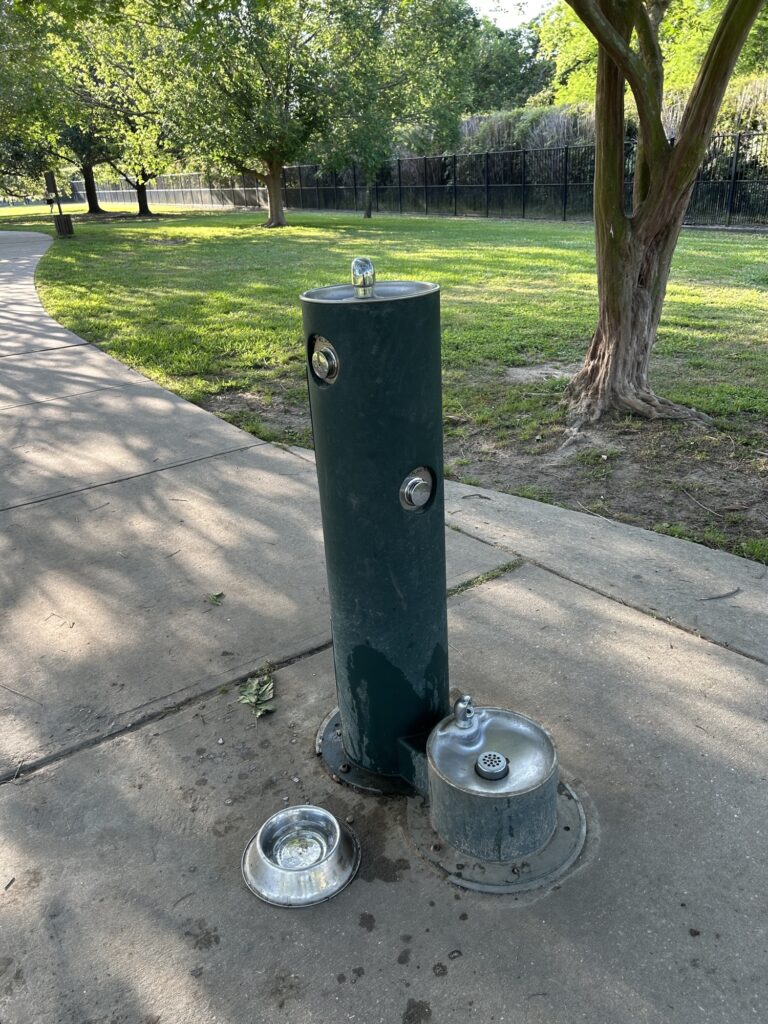 Water fountain for dogs with bowls in Nole City Bark dog park in New Orleans City Park Water fountain for dogs with bowls in Nole City Bark dog park in New Orleans City Park